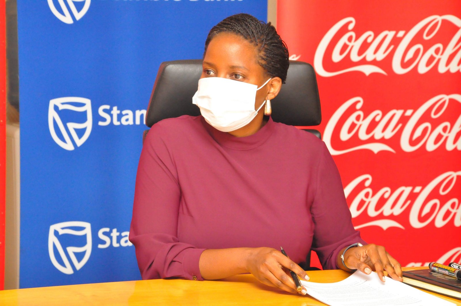 Anne Juuko, Stanbic Chief Executive speaks during the MoU signing ceremony on collaborative partnership between Stanbic, Coca Cola Beverages Africa and Nice House of Plastics