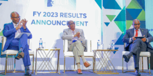 From Left: KCB Group Finance Director, Lawrence Kimathi, Group Chairman, Dr. Joseph Kinyua and Group CEO, Paul Russo exchange notes during the release of the 2023 Full Year Financial results.