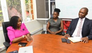 Poran L and Ibrahim R have a chat during the courtesy visit at the Stanbic Business Innovator offices in Kololo